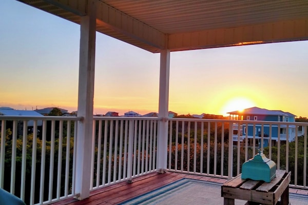 SUNSET VIEW FROM BALCONY WITH REMOTE CONTROL SCREENS UP! LOCATED ON 2nd FLOOR.