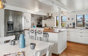 Fridge, stovetop, dishwasher, coffee/tea maker