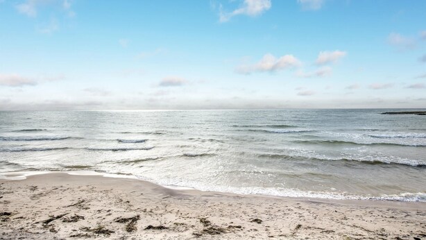 A beach with clear skies and gentle waves. - Beautiful home in Aakirkeby with WiFi (Aakirkeby)