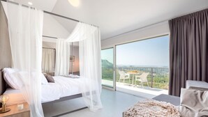 A bedroom with a bed, a nightstand, a bedside table, a large window, and a balcony with a table and chairs. - Gorgeous home in Klis (Klis)