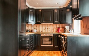 Fridge, stovetop, dishwasher, coffee/tea maker