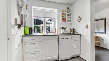 Fridge, stovetop, dishwasher, coffee/tea maker