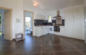 Fridge, stovetop, dishwasher, coffee/tea maker