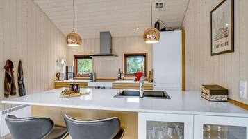 Fridge, stovetop, dishwasher, coffee/tea maker