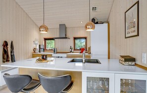 Fridge, stovetop, dishwasher, coffee/tea maker