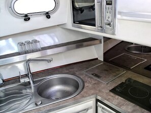 Fridge, microwave, stovetop, coffee/tea maker
