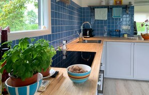 Fridge, stovetop, coffee/tea maker, cookware/dishes/utensils