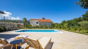 A house with a swimming pool, a stone wall, and a garden. - Amazing home in Tribalj (Tribalj)