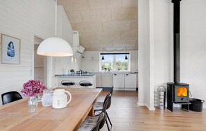 Enjoy meals in the kitchen with a central island and dining area.