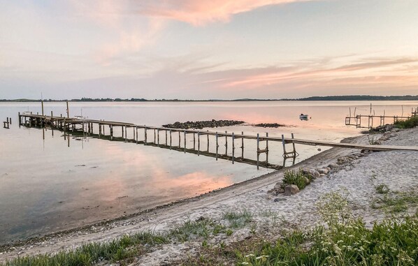 Enjoy a serene lakeside retreat with a tranquil atmosphere and access to the water.