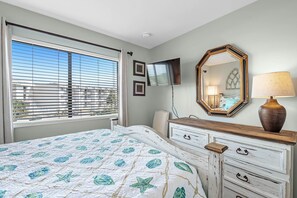 Relax in comfort with a large bed, flat-screen TV, and a dresser for your belongings.