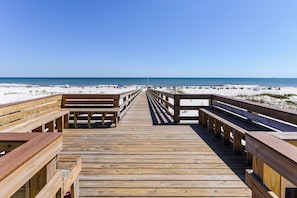 Walk along the boardwalk to the beach, where benches offer a place to sit and relax.