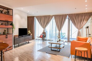 Standard Apartment | Living area | 32-inch LCD TV with cable channels, TV - Signature Holiday Homes (Dubai)
