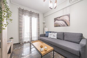 Apartemen Kota | Area keluarga | TV layar datar