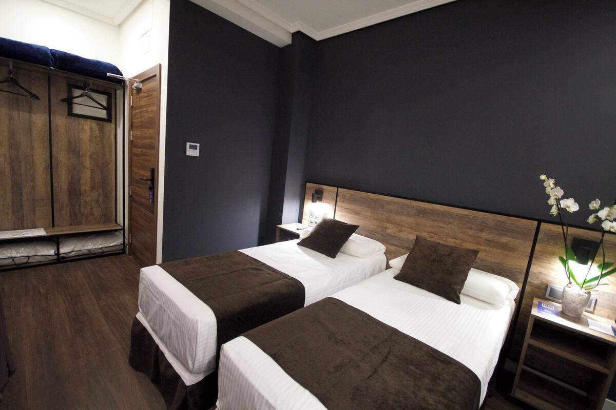 Standard Double Room | Minibar, in-room safe, desk, blackout curtains