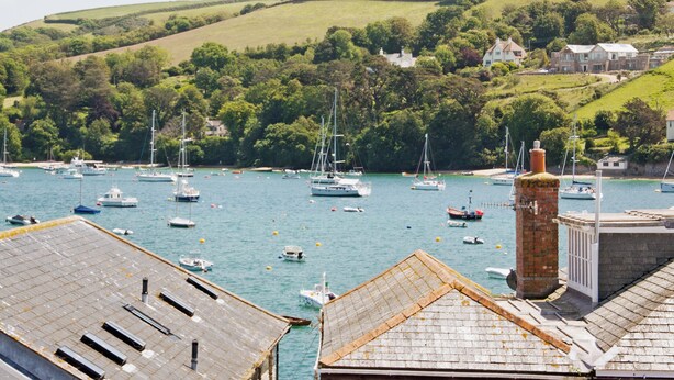 A harbor with boats, a brick chimney, and houses on a hillside. - 2 bedroom accommodation in Buckley St (Buckley St)