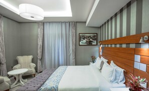 Frette Italian sheets, premium bedding, Tempur-Pedic beds, in-room safe