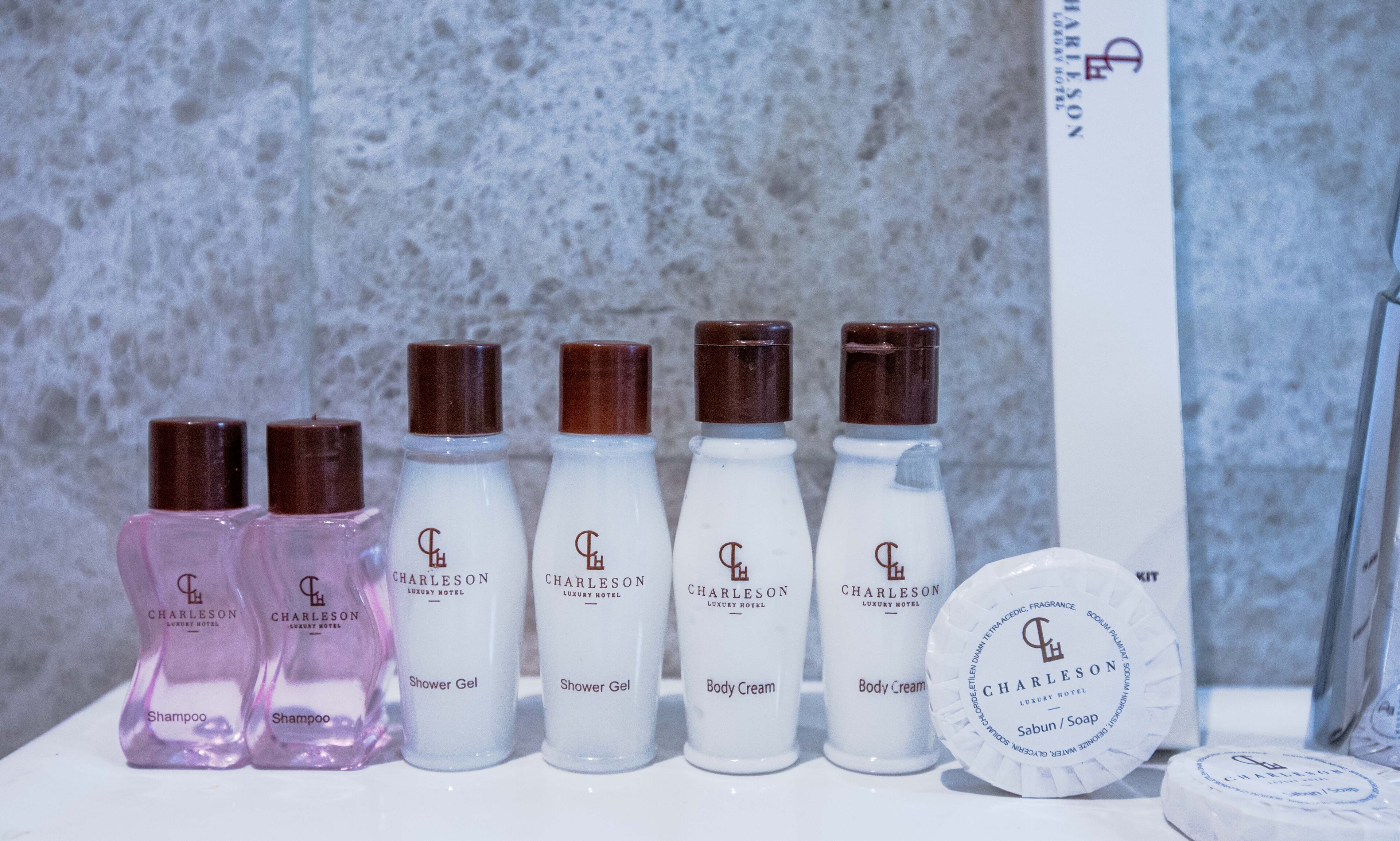 designer toiletries, hair dryer, bathrobes, slippers