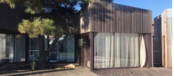 Architect-designed villa, walking distance to beach and town center, heated pool