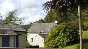 A rural setting with a house named 'Breasty Ham' and a wooden gate. - 3 bedroom accommodation in Satterthwaite (Satterthwaite)