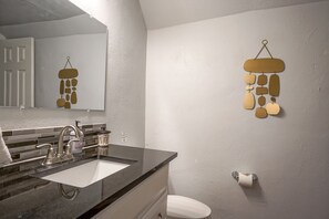 Combined shower/tub, hair dryer, towels, soap