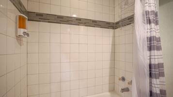 Combined shower/bathtub, hair dryer, towels, soap