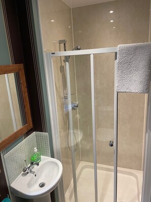 Shower, hair dryer, towels, soap