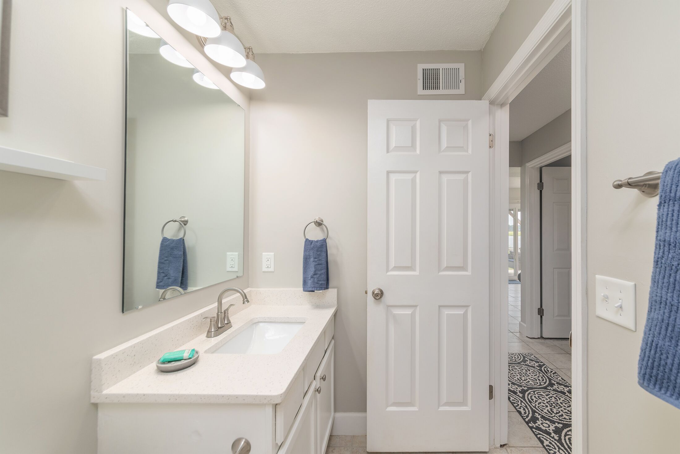 Combined shower/tub, hair dryer, towels, toilet paper