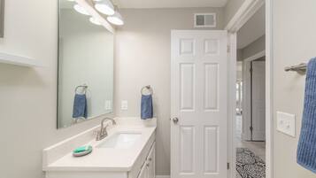 Combined shower/tub, hair dryer, towels, toilet paper