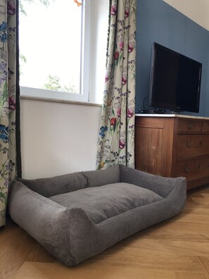 Relax in a cozy seating area with a flat-screen TV and comfortable seating.