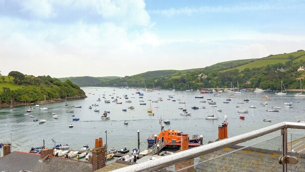 A harbor with numerous boats docked, surrounded by green hills and a clear sky. - 3 bedroom accommodation in Buckley St (Buckley St)