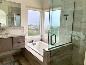 Bathtub, hair dryer, towels, soap