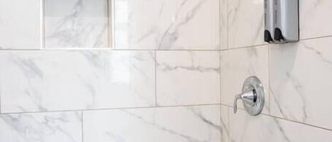 Shower, hair dryer, towels, shampoo