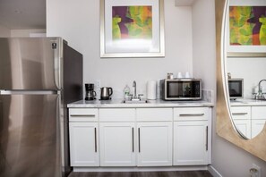 Fridge, microwave, stovetop, coffee/tea maker