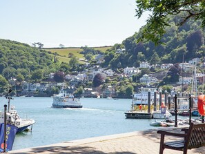 A harbor with boats, a dock, and a hillside with houses. - 2 bedroom accommodation in North Embankment (North Embankment)