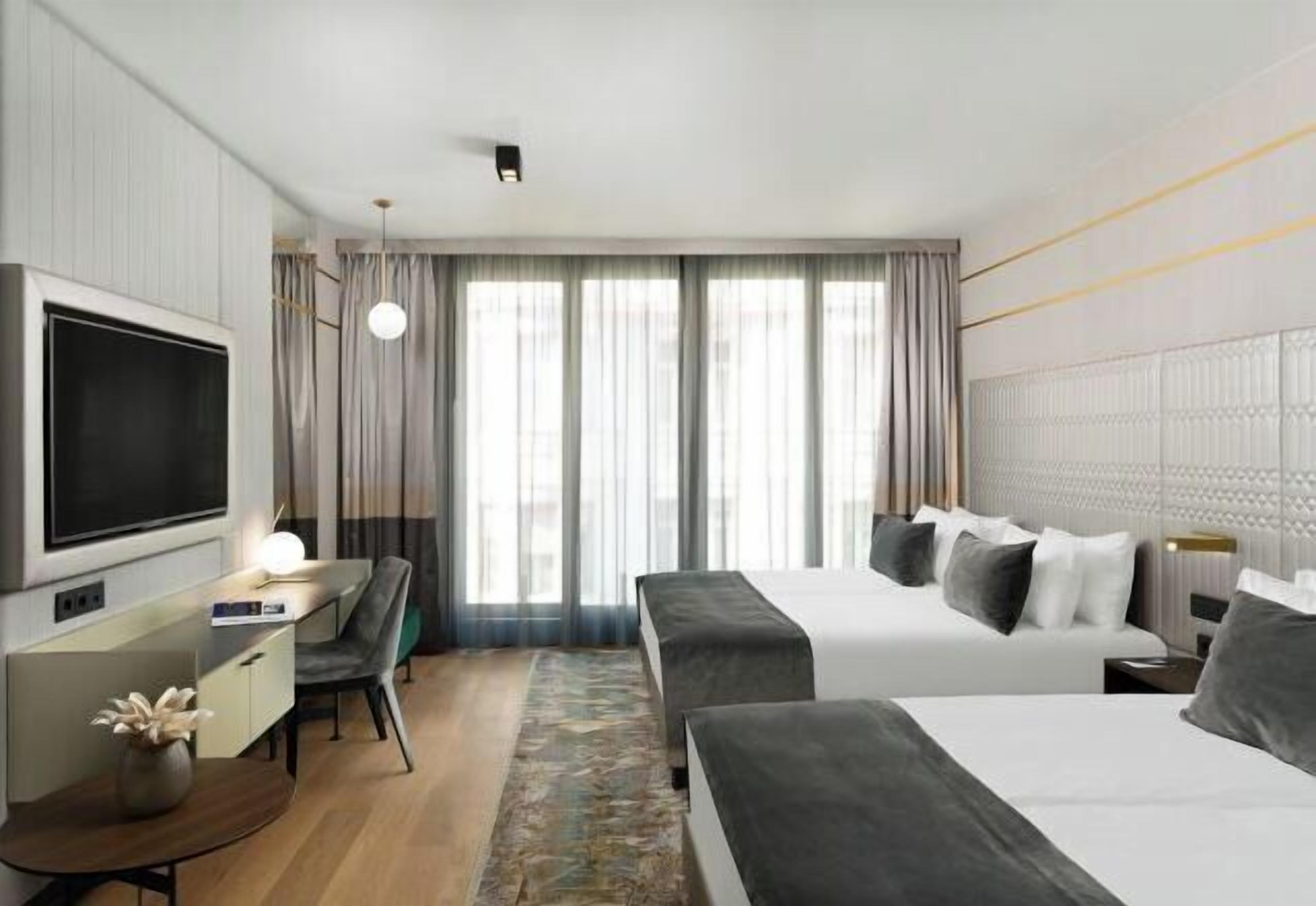 Ropa de cama de alta calidad, minibar, caja fuerte y cortinas opacas