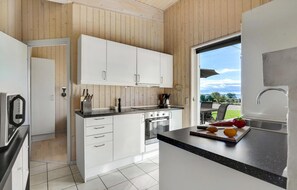 Fridge, dishwasher, coffee/tea maker, cookware/dishes/utensils