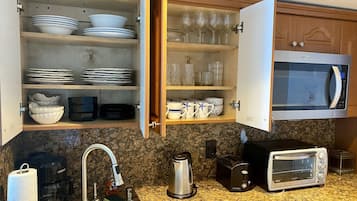 Fridge, microwave, stovetop, coffee/tea maker