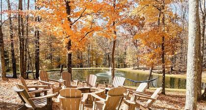 Spacious, family-friendly lodge on 10 wooded acres. Sleeps 20 with 5 bedrooms, stocked pond