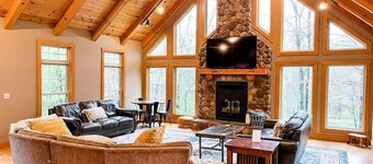 Spacious, family-friendly lodge on 10 wooded acres. Sleeps 20 with 5 bedrooms,  stocked pond