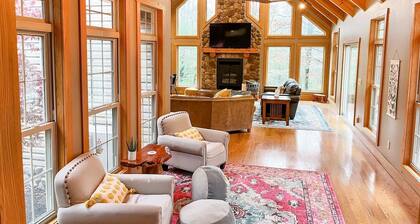Spacious, family-friendly lodge on 10 wooded acres. Sleeps 20 with 5 bedrooms, stocked pond