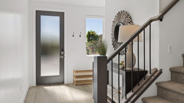 A modern interior with a staircase, a bench, and a window with blinds. - Perfect Escape - Brand New St. George Townhome (St. George)