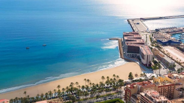 A coastal cityscape with a beach, a marina, and a large hotel complex. - Modern apartment right in centre of Alicante Spain (Alicante)