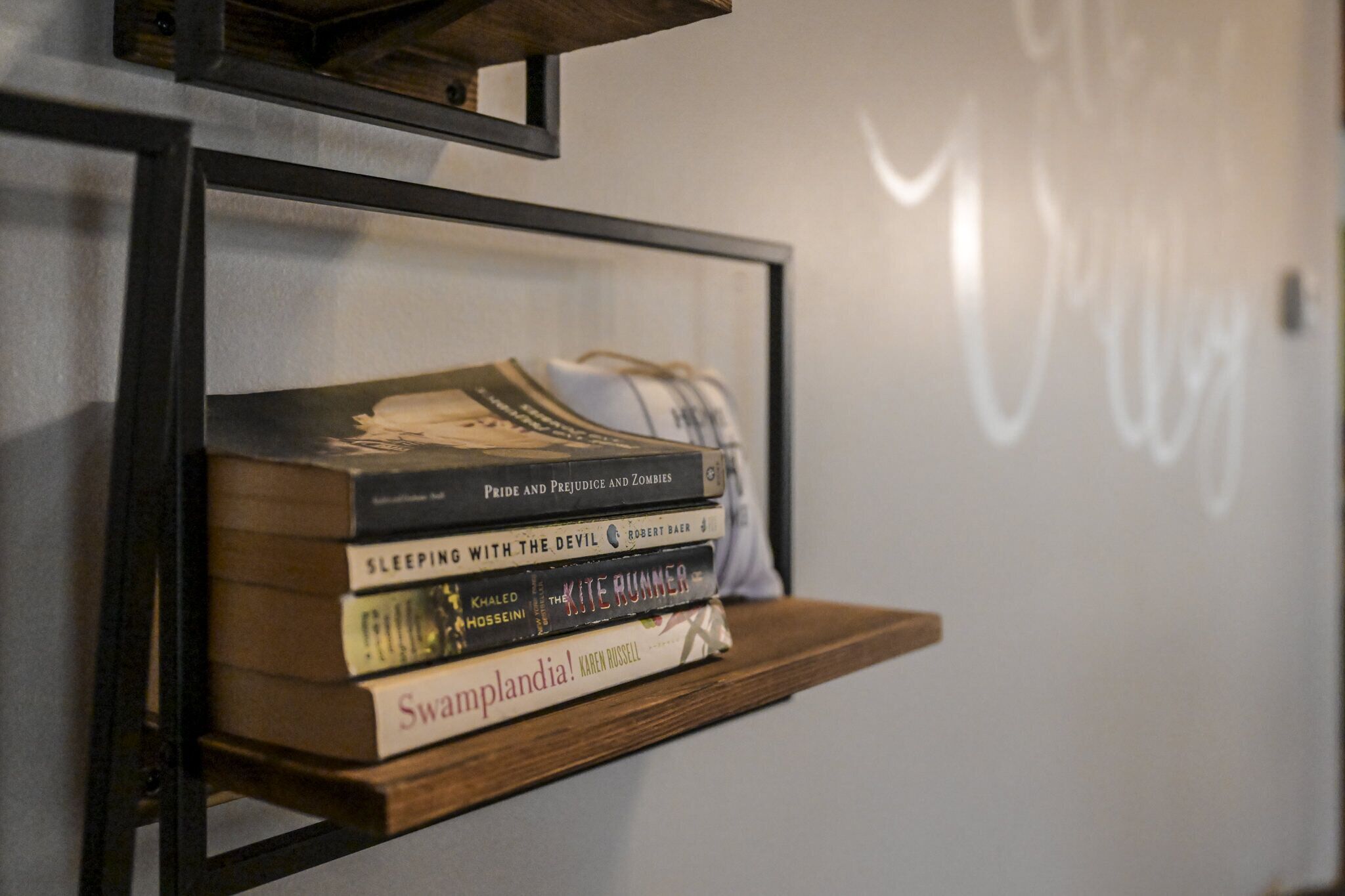 A bookshelf with several books.