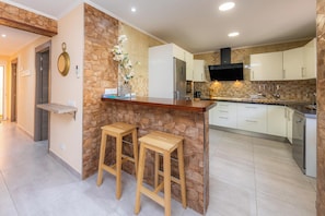 Fridge, microwave, oven, stovetop - "Can Caragol" Holiday Apartment with Private Terrace, A/C & WiFi (Cala Rajada)