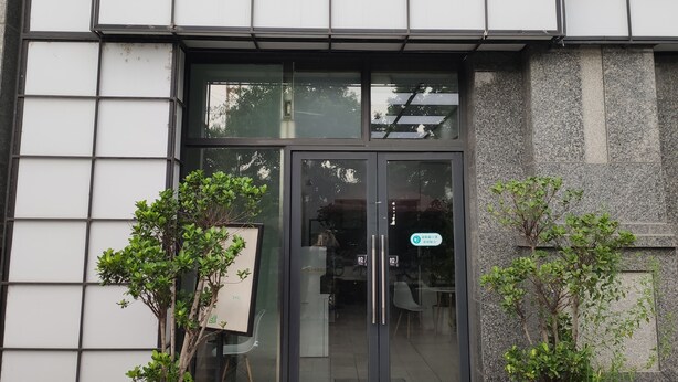 A building entrance with a sign reading "Let's Play".