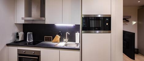 Fridge, microwave, stovetop, coffee/tea maker