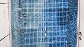 Shower, free toiletries, hair dryer, slippers