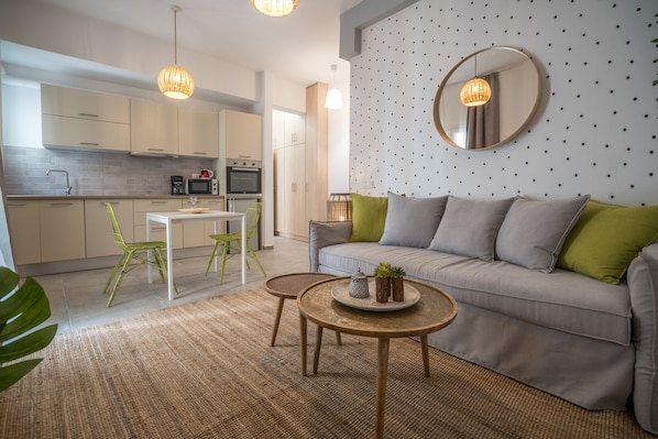 Superior Apartment | Living area | 43-inch flat-screen TV with cable channels