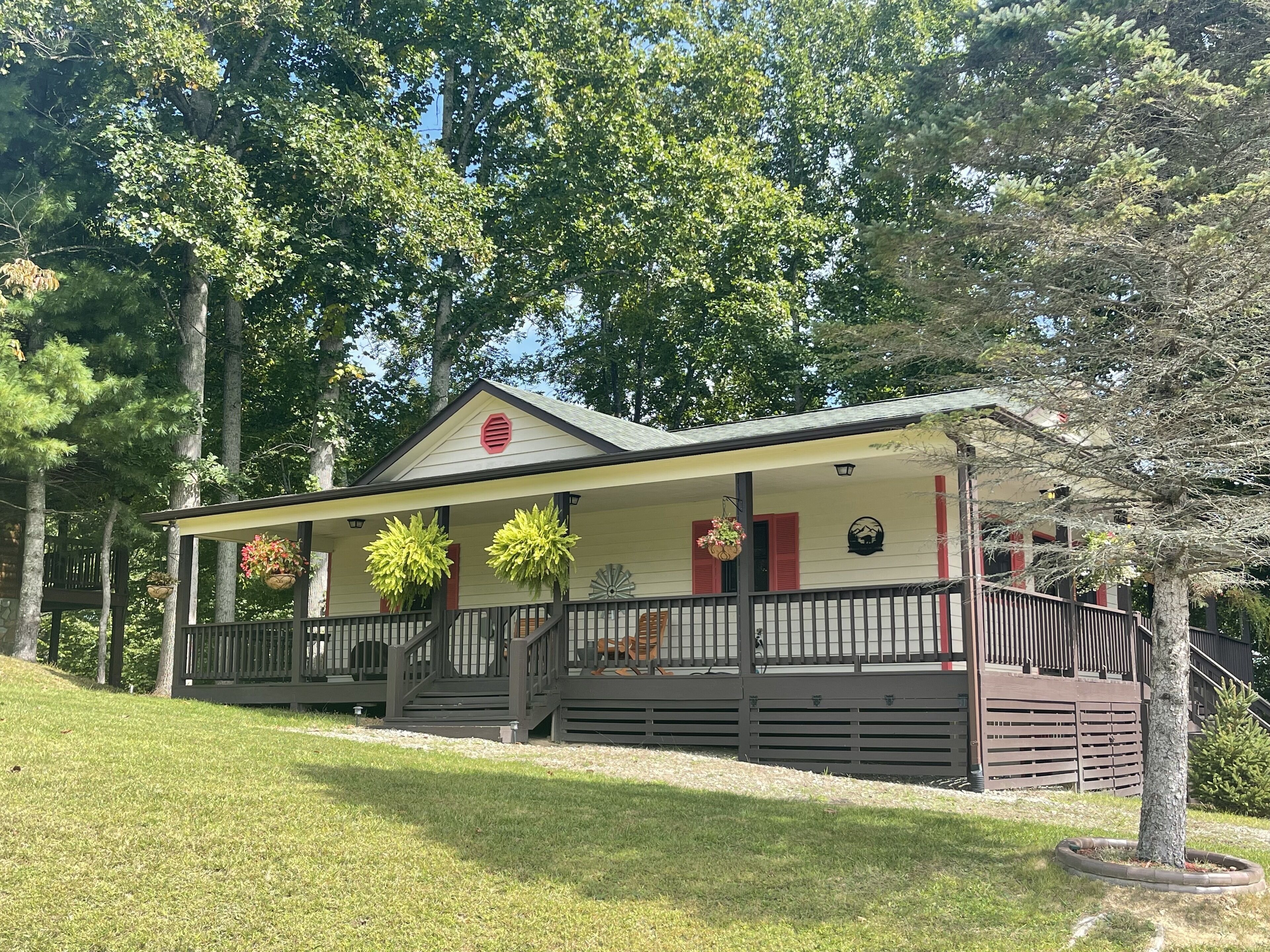 Quaint Piney Creek cabin with wrap-around deck will restore you!